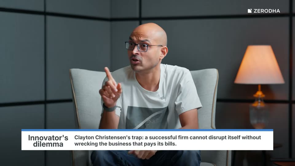 On-screen card: Innovator's dilemma. Clayton Christensen's trap: a successful firm cannot disrupt itself without wrecking the business that pays its bills.