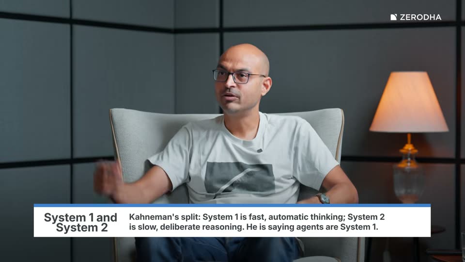 On-screen card: System 1 and System 2. Kahneman's split: System 1 is fast, automatic thinking; System 2 is slow, deliberate reasoning. He is saying agents are System 1.